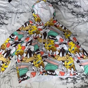 soft material. hasn’t been warn. looney toons hoodie. a little cropped or loose